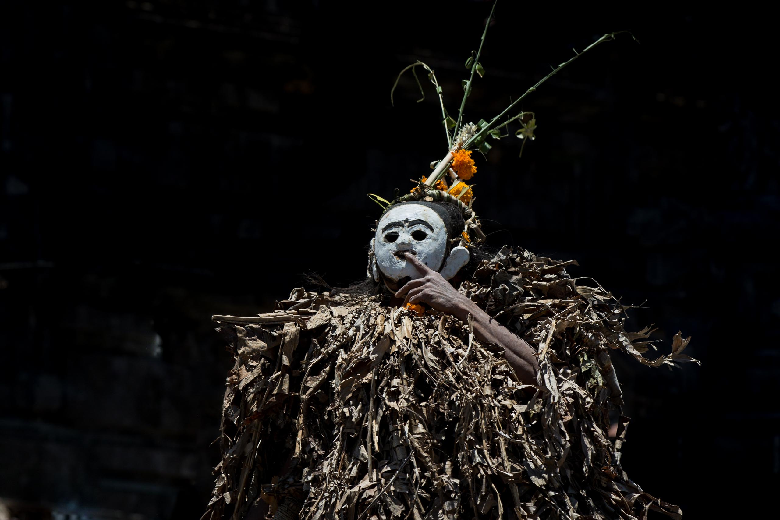 Barong Brutuk dancer wearing dried banana leaf costume in Trunyan Bali